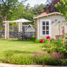 A bright green lawn in an English garden