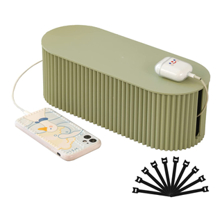 A sage green fluted cord management box