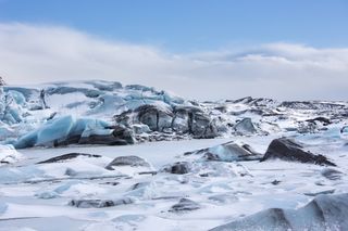 Long ago, glaciers may have bulldozed away hundreds of millions of years of sedimentary rock. Shown here, ice blocks of Svinafellsjokull glacier in Iceland.