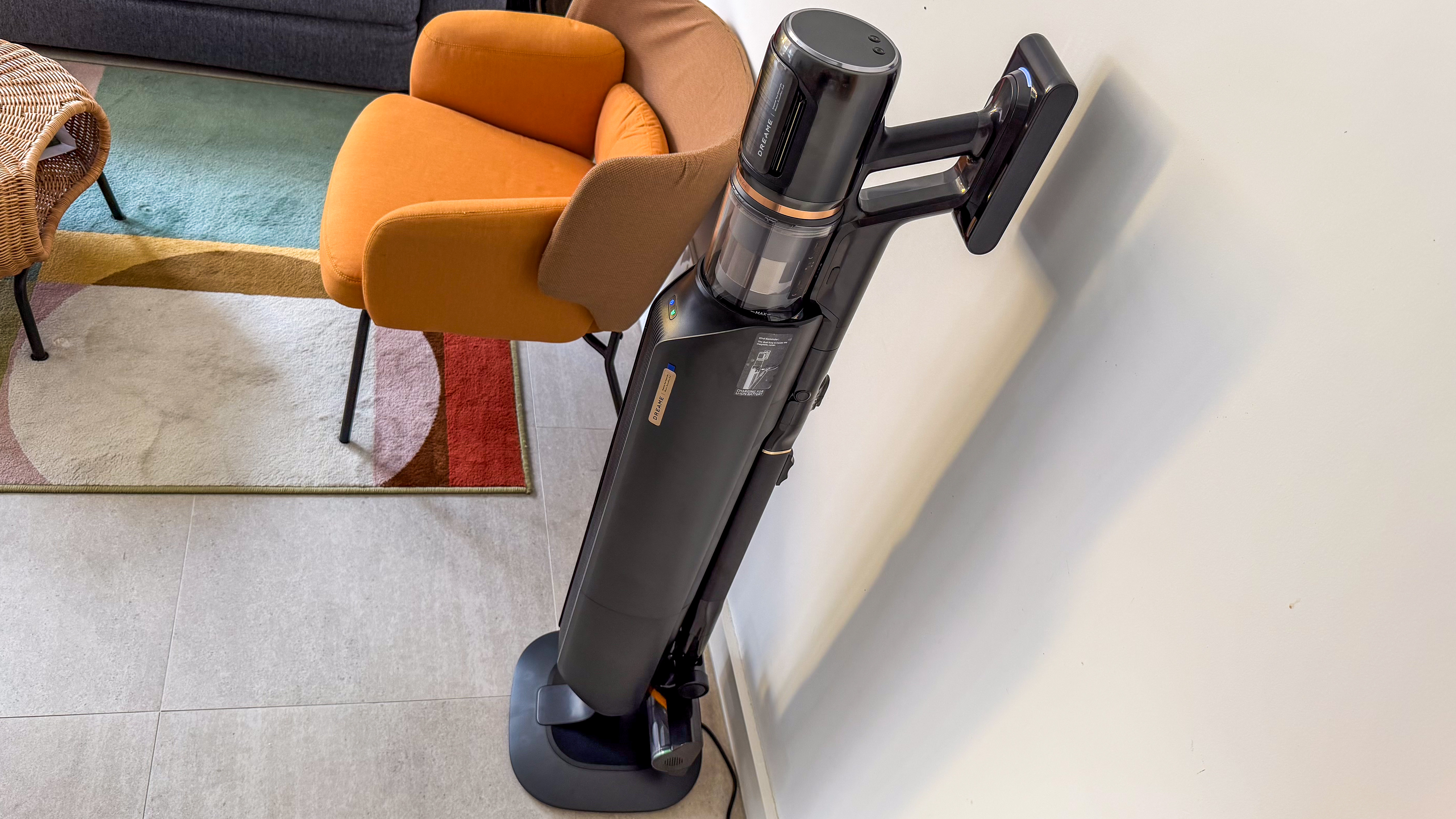 Dreame Z50 Station standing beside an armchair