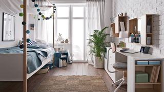 Teen bedroom with four poster bed, Scandi theme and desk space