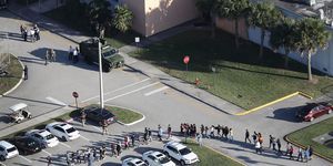 Scene of high school shooting - children being led away