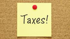 taxes post it note on bulletin board for IRS extends tax deadline