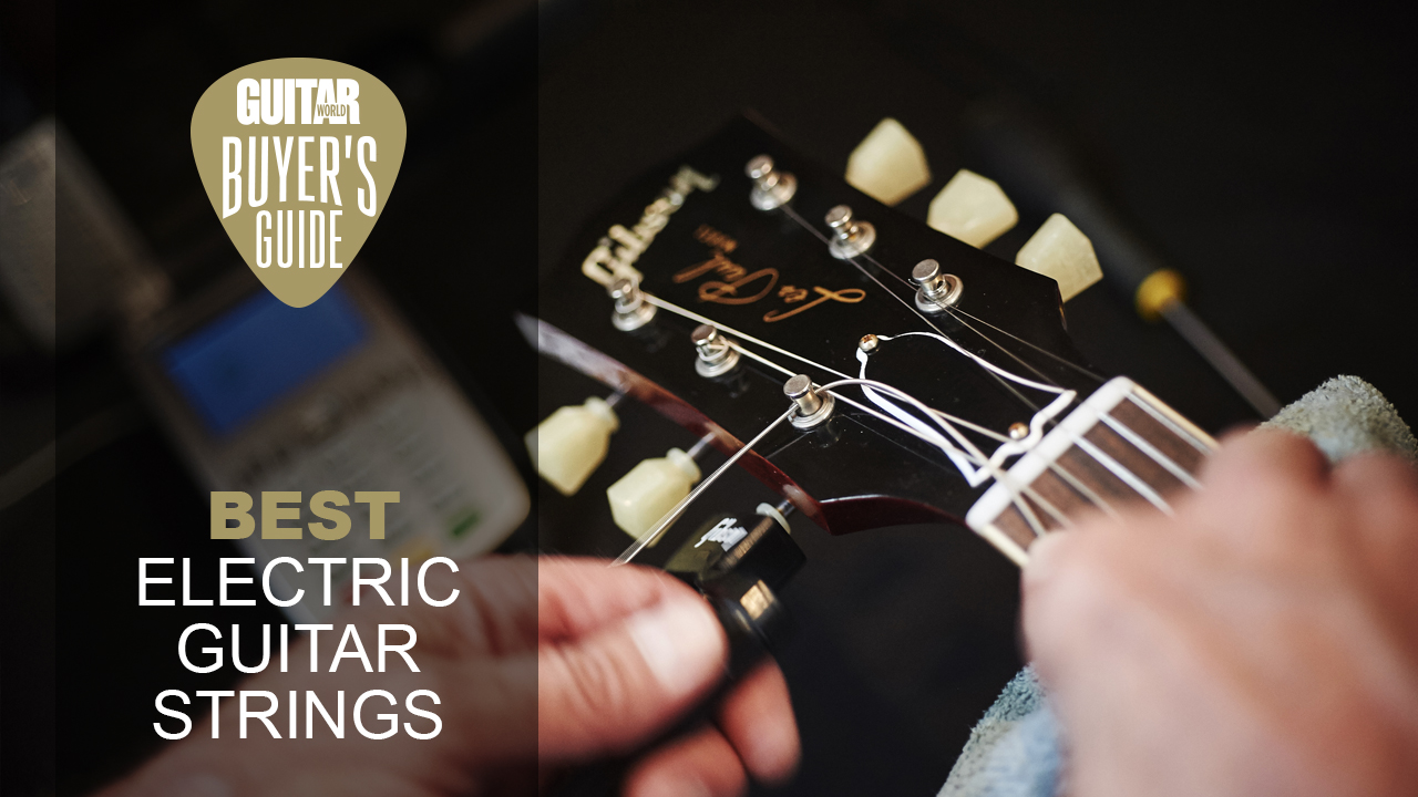 A man changes guitar strings on a Gibson Les Paul electric guitar