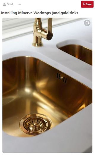 bathroom with gold sink and marble work top