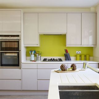 kitchen with white cabinet and microwave