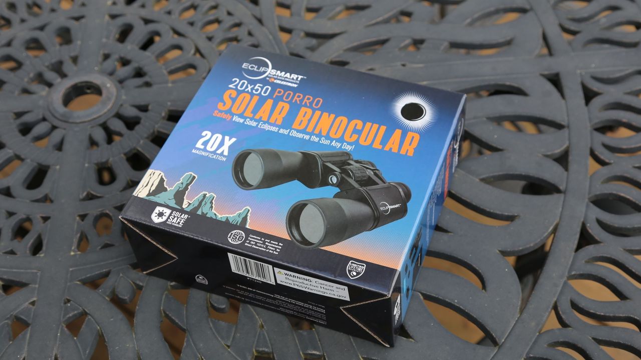 Celestron EclipSmart 20x50mm Porro solar binoculars in their box on a table.
