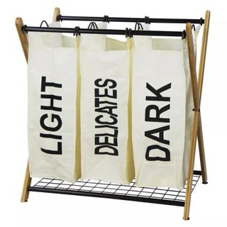 The Oceanstar X-Frame 3-Bag Laundry Sorter on a white background. It has three compartments - one each for light, delicate, and dark laundry