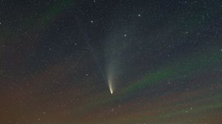 A comet swoops across the sky