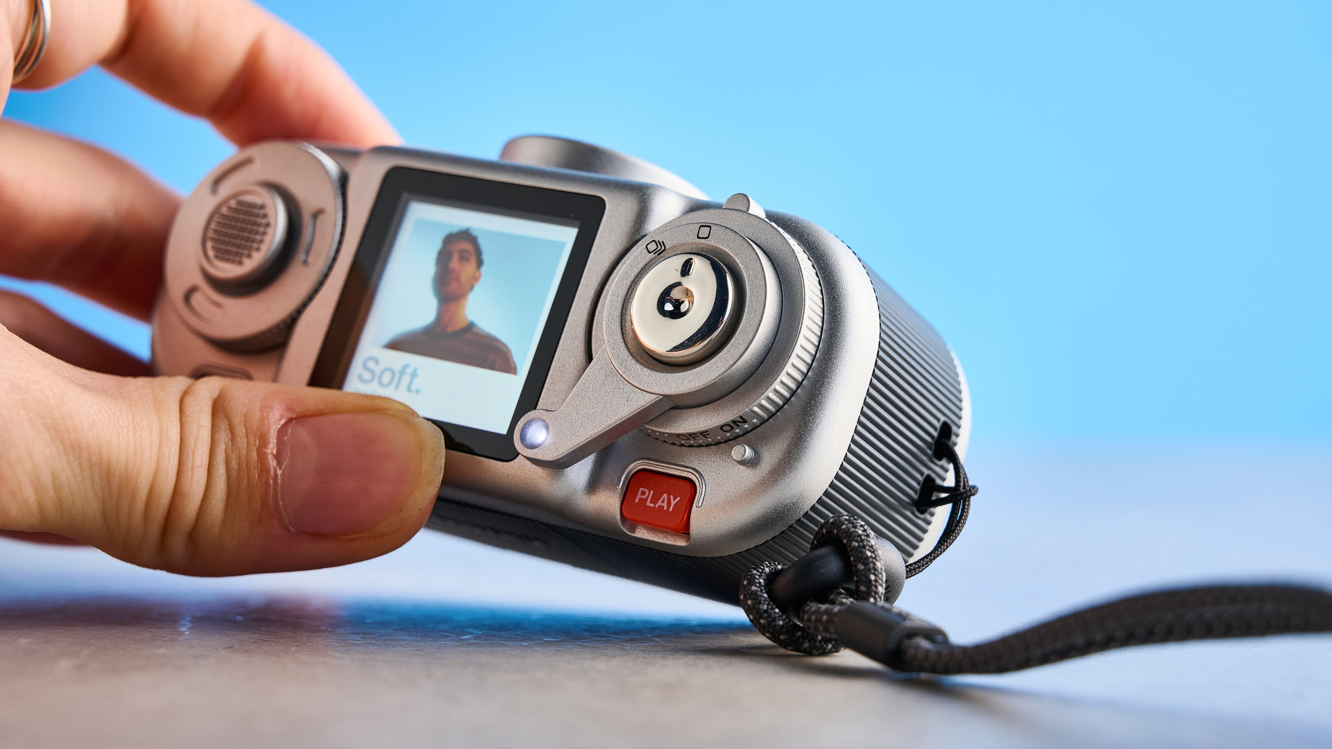 A black and silver Fujifilm Instax Pal 2 digital camera
