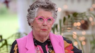 Prue Leith judging a cake on The Great British Baking Show