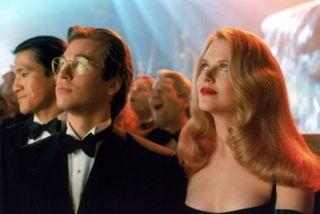 Val Kilmer as Bruce Wayne and Nicole Kidman as Chase Meridian