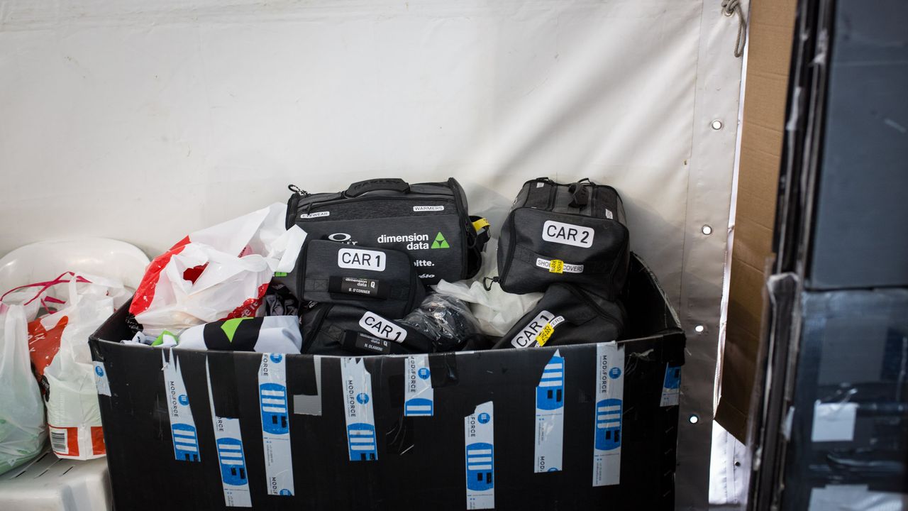 Dimension Data had kit bags laid out for the riders and labelled which cars they'd be going into