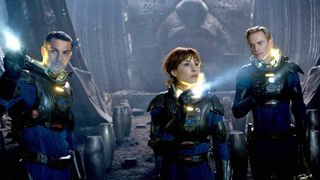 Noomi Rapace as Elizabeth Shaw, Michael Fassbender as David, and Logan Marshall-Green as Charlie Holloway in the movie Prometheus.