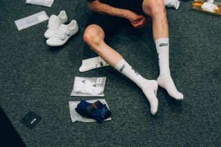 Tom putting on a pair of Aero Cycling Gear aero socks