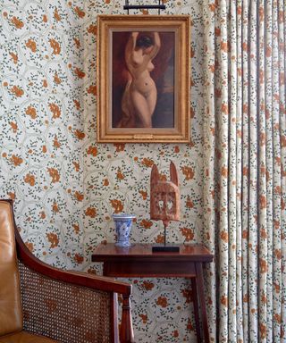 orange and white bennison fabric used as fabric walling in a sitting room setting by kate guinness design