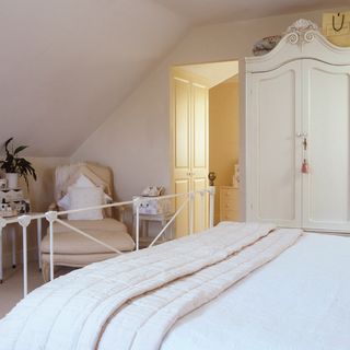 bedroom with white wall and chair