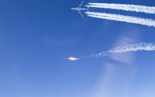 Virgin Orbit's LauncherOne rocket blasts its way toward space after separating from its carrier plane during the successful Launch Demo 2 mission on Jan. 17, 2021.