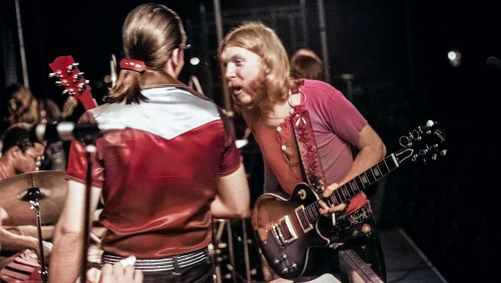 J. Geils of the J. Geils Band chats with Duane Allman of The Allman Brothers Band during a break from a performance at the Sunset concert series 'Summerthing' at Boston Common in Boston, MA in the summer of 1971.