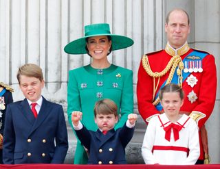 Prince George of Wales, Prince Louis of Wales, Catherine, Princess of Wales (Colonel of the Irish Guards), Princess Charlotte of Wales and Prince William, Prince of Wales (Colonel of the Welsh Guards) watch an RAF flypast from the balcony of Buckingham Palace during Trooping the Colour on June 17, 2023 in London