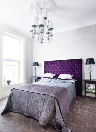 Bedroom with purple headboard