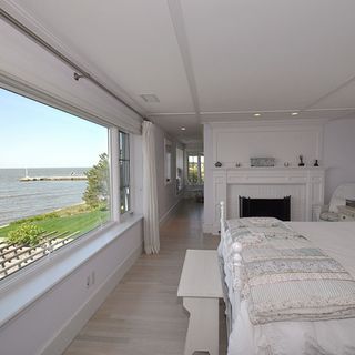 bedroom with white wall and sea view