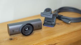 Logitech MX Brio webcam on a wooden table
