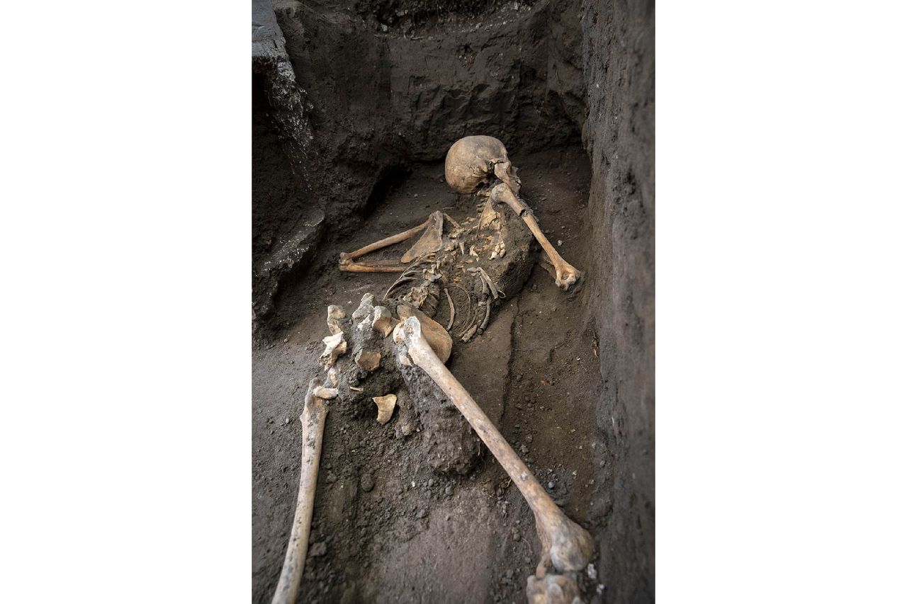 a skeleton of Pompeii victim on the ground