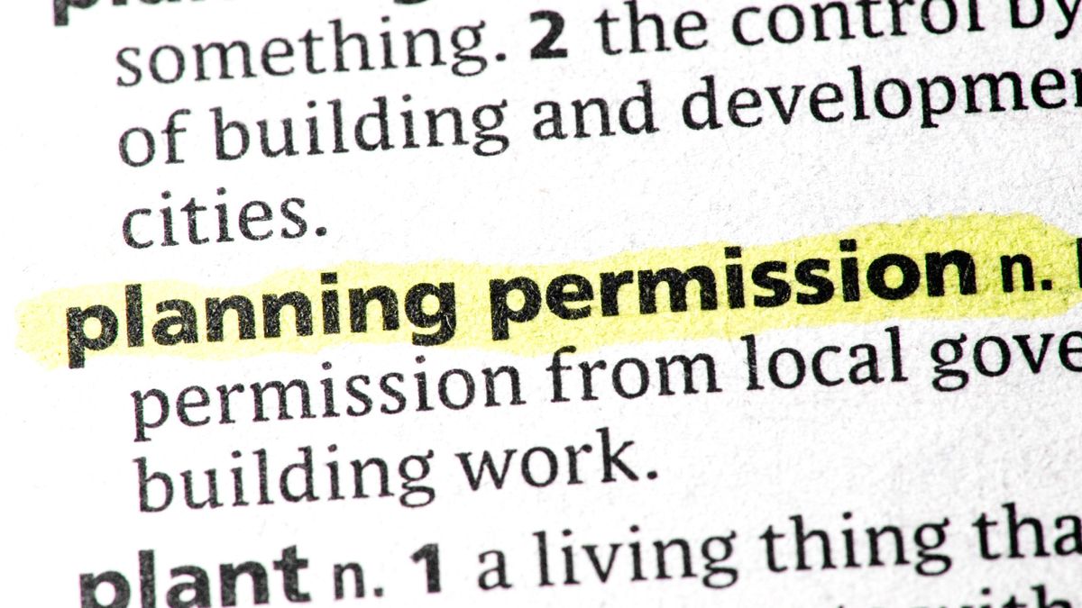 close up of document with words planning permission highlighted in yellow