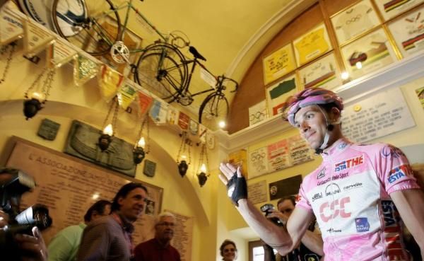 Giro d'Italia leader Ivan Basso pays his respects at the Madonna del Ghisallo chapel.