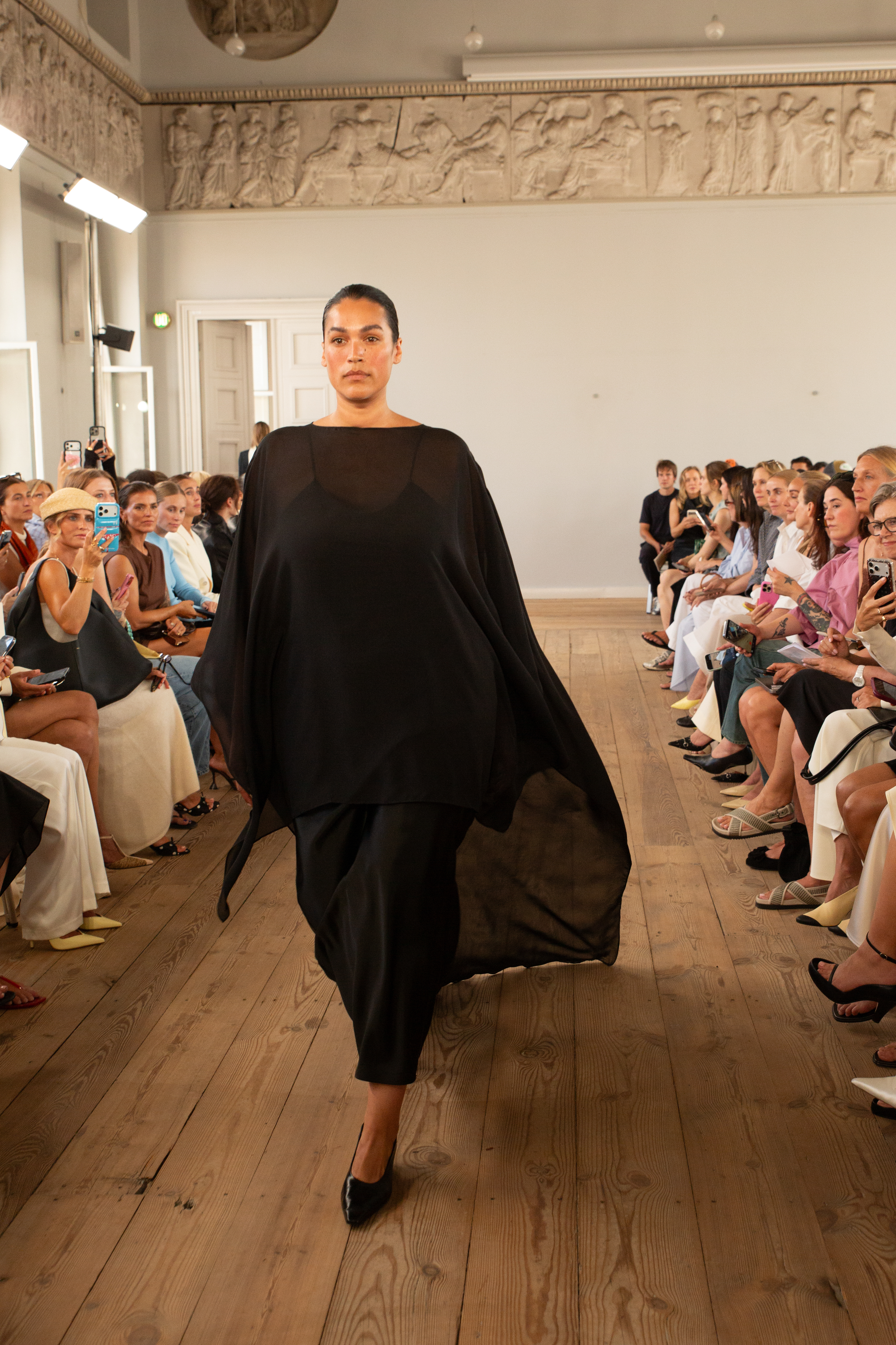 Jennifer Atilemile walking in a show during Copenhagen Fashion Week.