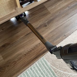 Shark PowerDetect Clean and Empty Cordless Vacuum testing process vacuuming under furniture