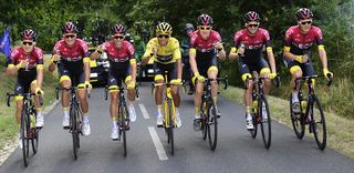 Egan Bernal in yellow surrounded by Team Ineos stage 21 at the Tour de France