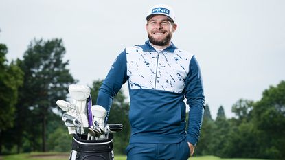 Tyrrell Hatton poses in a hoodie