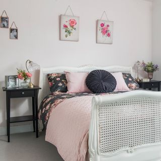 Grey bedroom with pink floral prints above the bed
