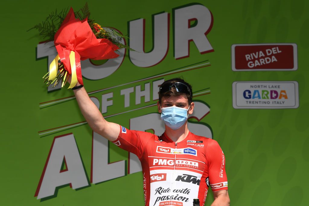 RIVA DEL GARDA ITALY APRIL 23 Felix Engelhardt of Germany and Tirol KTM Cycling Team Red Sprint Jersey celebrates at final podium during the 44th Tour of the Alps 2021 Stage 5 a 1209km stage from Valle del Chiese Idroland to Riva del Garda Mask Covid Safety Measures TourofTheAlps TouroftheAlps on April 23 2021 in Riva del Garda Italy Photo by Tim de WaeleGetty Images