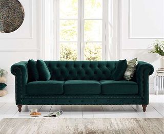 living room with white scheme and green velvet sofa by oak furniture superstore