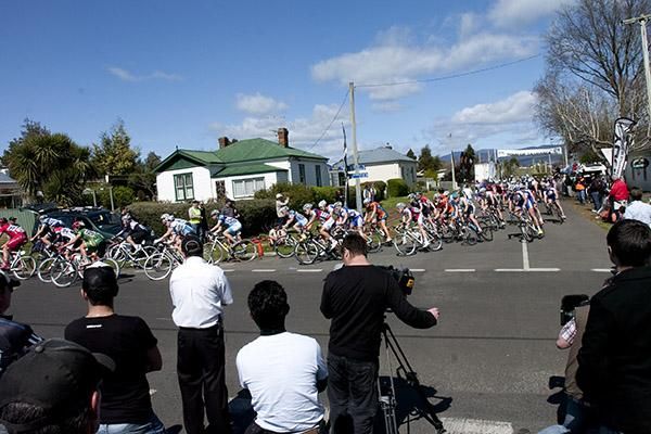 The peloton corner out of the home straight in Westbury for the final stage of the 2010 Caterpillar Underground Mining Tour of Tasmania.