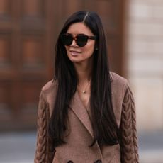 best ghd straighteners - woman with long straight dark brunette hair - gettyimages - 1421646179