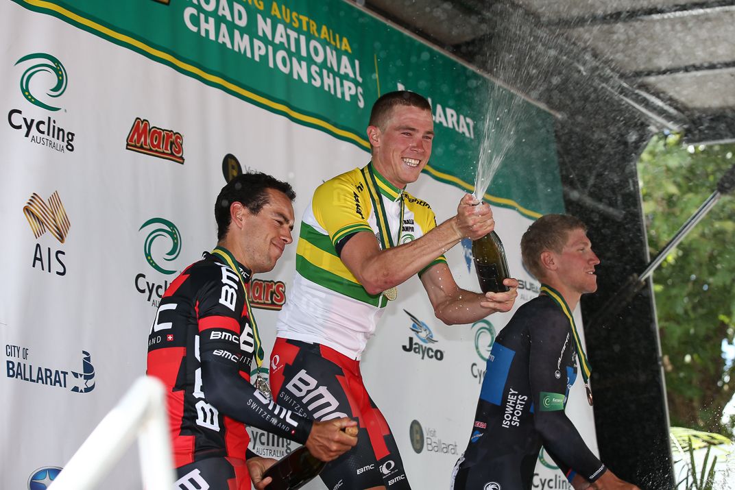 Rohan Dennis enjoys spraying the champagne on the podium