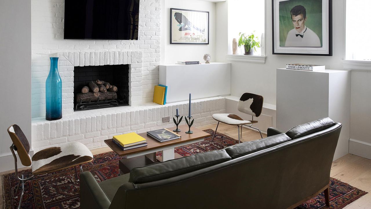 living room with white walls and leather sofa