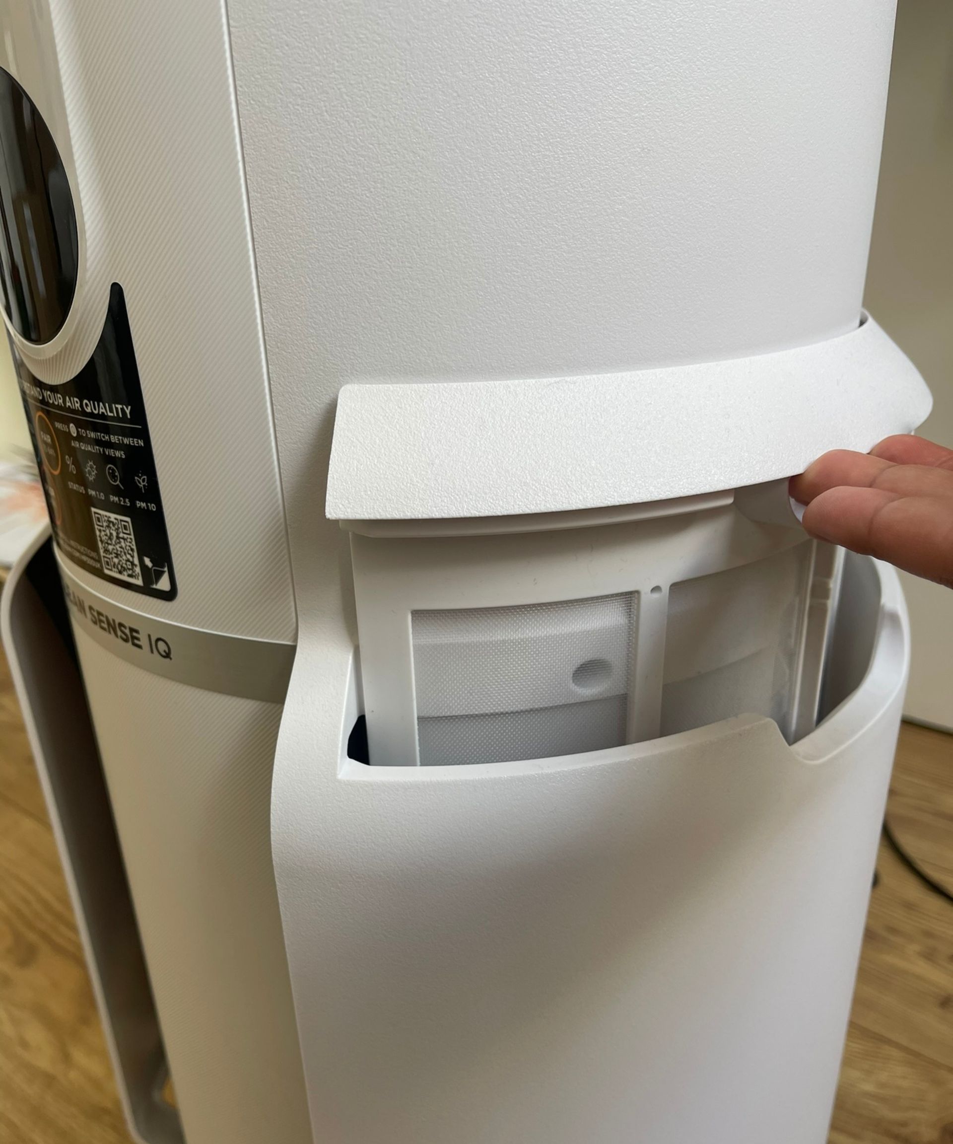 Lifting the pre-filters out of the Shark NeverChange Air Purifier MAX during testing in my home.