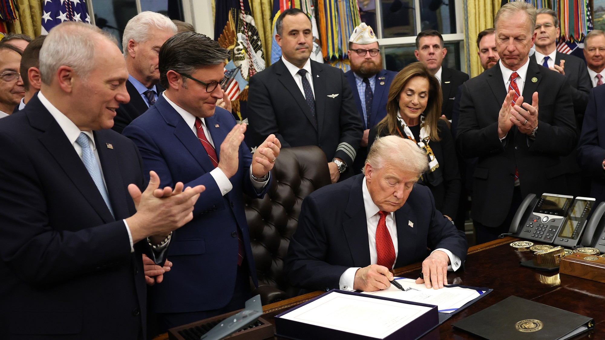 Donald Trump signing funding bill in White House