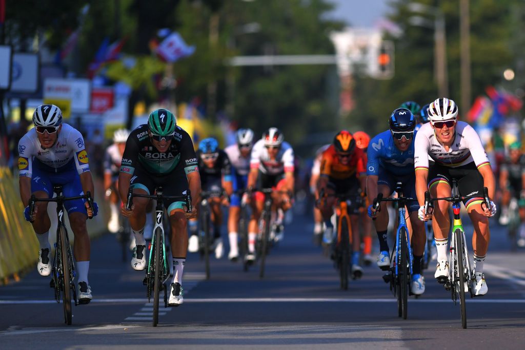 Pascal Ackermann (Bora-Hansgrohe) and Davide Ballerini (Deceuninck-Quickstep) get nabbed in shadow of Mads Pedersen (Trek-Segafredo) on Stage 2, finishing 2-3