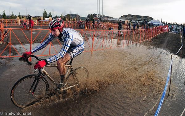 A Lindsey Wilson College rider plows through standing water.