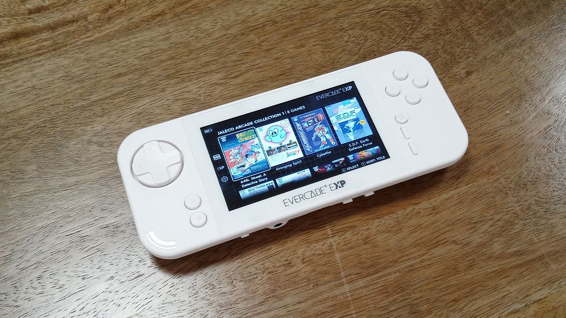 Evercade EXP review; a white handheld games console on a wooden table