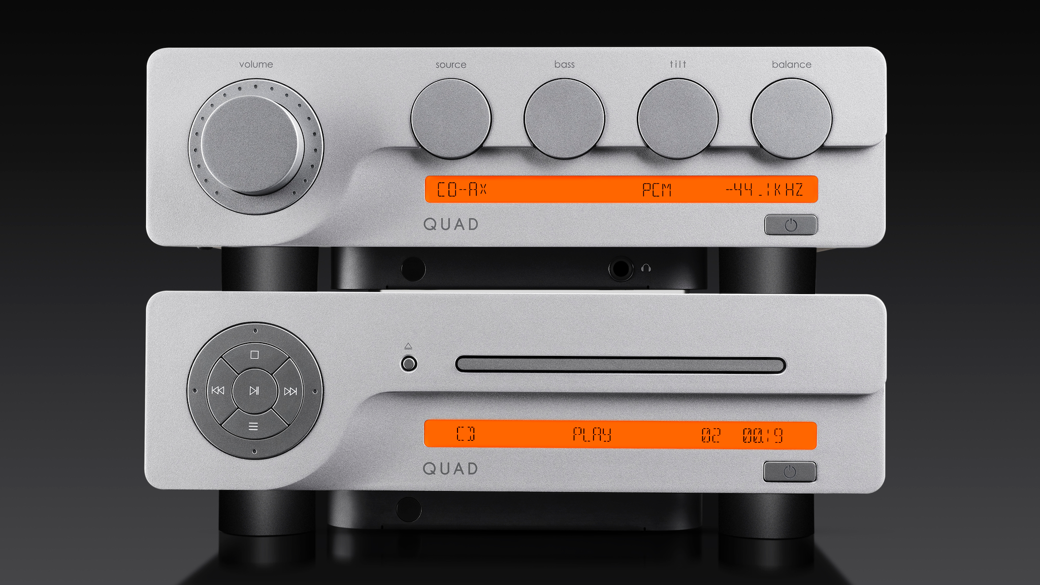 The Quad 3CDT with a Quad 3 amp on top of it against a dark background