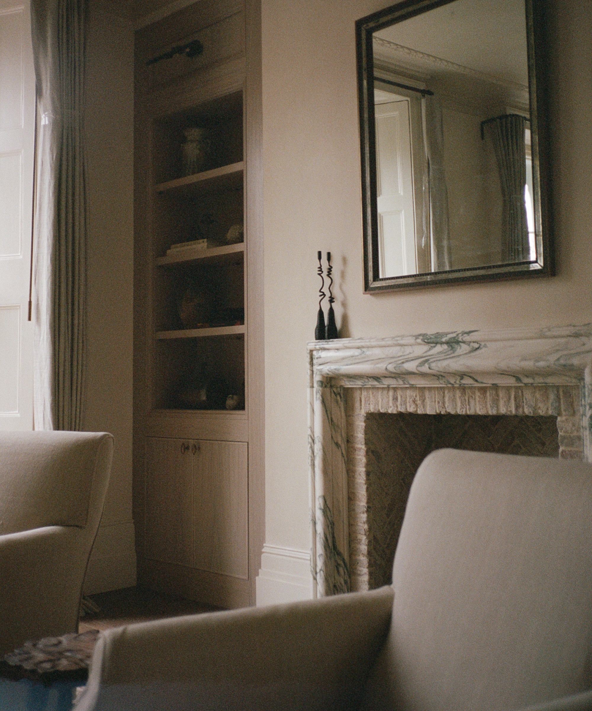 living room with marble fireplace