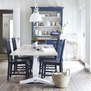 dining room with white wall and dining table