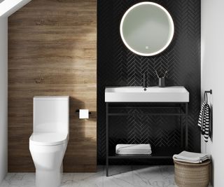 small bathroom with wood effect tiles, next to black wall panelling and a freestanding black framed vanity unit